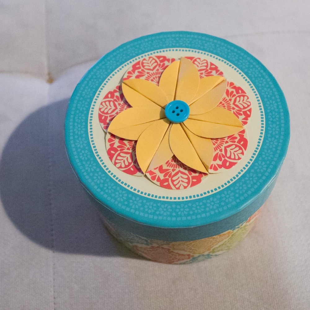 Daisy colored cardboard tin from hallmark